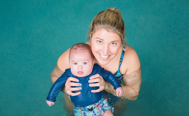 Mother and Baby in Pool During Water Babies Class