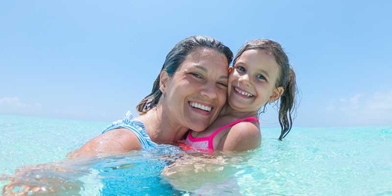 swimming-on-vacation, mom and daughter in ocean