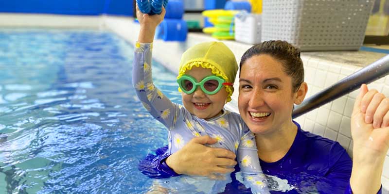 Swim Teacher and Baby with Cute Swim Cap