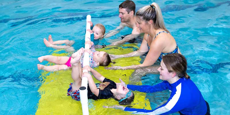 Three toddlers in a swimming lesson at Njswim in Turnersville NJ