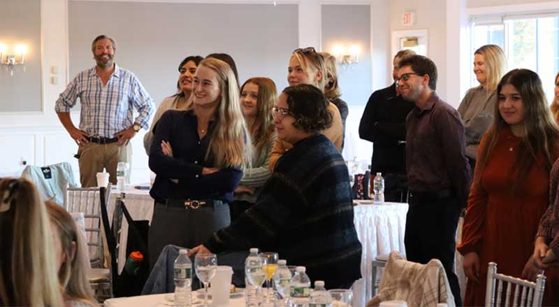 Njswim Founder Joe Oehme and swim team at event