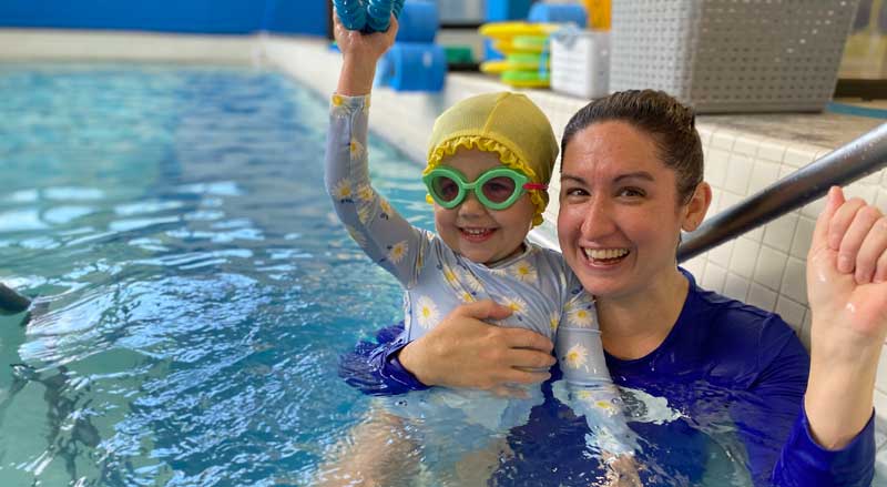 A Njswim teacher with her student in the pool