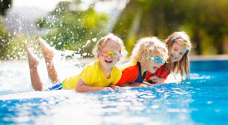 Aerial view of a pool with dark bottom