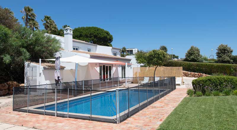 A fenced-in pool in a private backyard